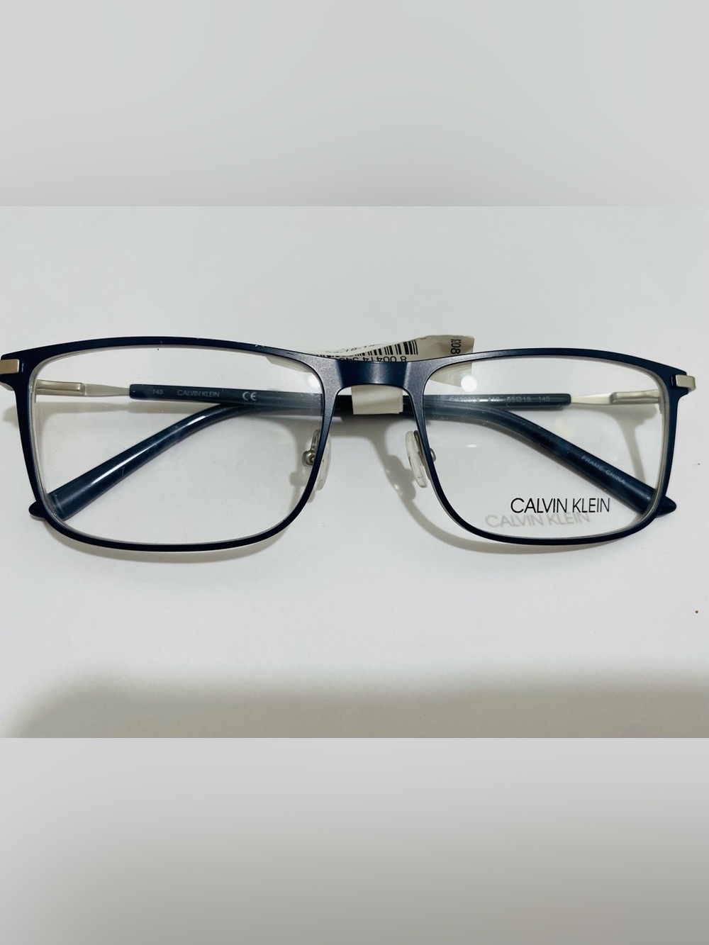 Calvin Klein Silver Frame Glasses with Navy Temples